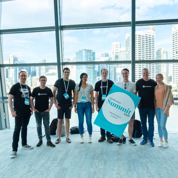 Team watching conference together in meeting room